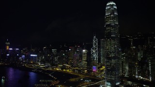 SS01_0186 - 5K stock footage aerial video flyby International Finance Centre and waterfront towers at night on Hong Kong Island, China