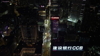 SS01_0191 - 5K stock footage aerial video approach Nathan Road and office buildings at night in Kowloon, Hong Kong, China