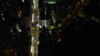SS01_0197 - 5K stock footage aerial video fly over office buildings by Nathan Road at night in Kowloon, Hong Kong, China