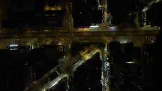 SS01_0201 - 5K stock footage aerial video bird's eye of narrow streets at night through Kowloon, Hong Kong, China