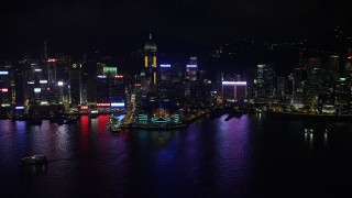 SS01_0202 - 5K stock footage aerial video approach convention center and Central Plaza high-rise at night on Hong Kong Island, China