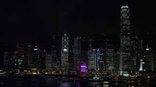 SS01_0218 - 5K stock footage aerial video approach and zoom in on Bank of China Tower on Hong Kong Island at night, China