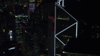 SS01_0227 - 5K stock footage aerial video orbit Bank of China Tower to reveal a pair of high-rises at night on Hong Kong Island, China