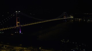 SS01_0241 - 5K stock footage aerial video approach Tsing Ma Bridge at night in Hong Kong, China