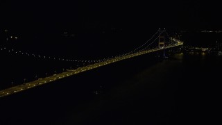SS01_0242 - 5K stock footage aerial video approach the center of the Tsing Ma Bridge at night in Hong Kong, China