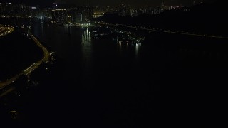 SS01_0249 - 5K stock footage aerial video flyby Ting Kau Bridge at night and tilt to reveal piers on the Rambler Channel in Hong Kong, China