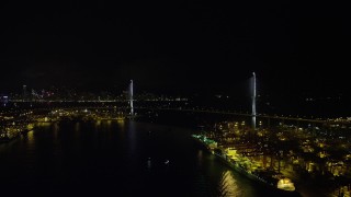 SS01_0264 - 5K stock footage aerial video approach the Stonecutters Bridge at night from Rambler Channel in Hong Kong, China