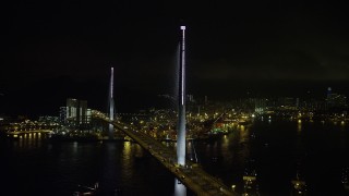 SS01_0267 - 5K stock footage aerial video orbit of the Stonecutters Bridge over Rambler Channel at night in Hong Kong, China