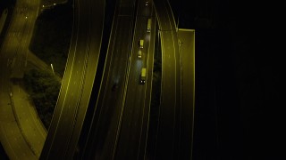 SS01_0270 - 5K stock footage aerial video bird's eye view of cars and trucks on a freeway at night on Lantau Island, Hong Kong, China