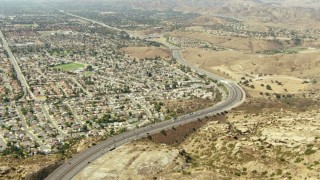 TS01_002 - 1080 stock footage aerial video follow the 118 freeway to neighborhoods in Simi Valley, California