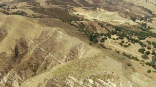 TS01_010 - 1080 stock footage aerial video tilt from bird's eye view of hills in Simi Valley, California