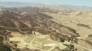 TS01_011 - 1080 stock footage aerial video of flying over barren hills and valleys in Simi Valley, California