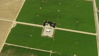 TS01_040 - 1080 stock footage aerial video of a bird's eye of farmhouse and fields, Cuyama Valley, California