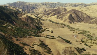 TS01_106 - 1080 stock footage aerial video of flying over Peach Tree Valley with rural homes near mountains, California