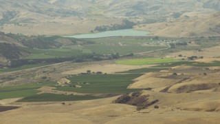 TS01_113 - 1080 stock footage aerial video of farmland around a reservoir in Paicines, California