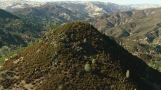 TS01_130 - 1080 stock footage aerial video of flying over a peak in the Ohlone Regional Wilderness, California