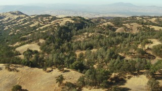 TS01_133 - 1080 stock footage aerial video of hills in the Ohlone Regional Wilderness, Mount Diablo in background, California