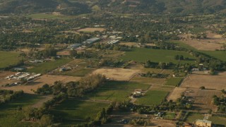 TS01_173 - 1080 stock footage aerial video pan across farm fields and homes in Sonoma, California