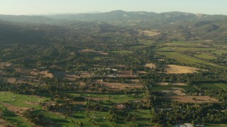 TS01_179 - 1080 stock footage aerial video of golf course, homes and farm fields in Sonoma, California
