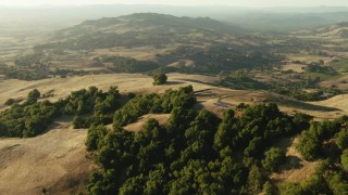 TS01_189 - 1080 stock footage aerial video of flying over homes and hills to approach hills in Sonoma County, California