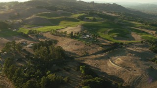 TS01_192 - 1080 stock footage aerial video fly over homes to approach vineyard in Bennett Valley, California