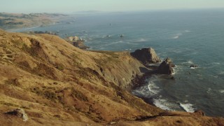 TS01_204 - 1080 stock footage aerial video approach rock formations on the California Coast, overlooking the ocean