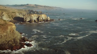 TS01_206 - 1080 stock footage aerial video of rock formations in the ocean on the California Coast