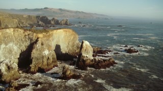 TS01_207 - 1080 stock footage aerial video of flying over rock formations and ocean on the California Coast