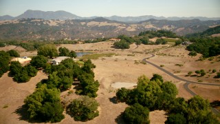 TS01_228 - 1080 stock footage aerial video of flying by hilltop homes, small pond in Santa Rosa, California