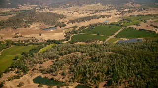TS01_246 - 1080 stock footage aerial video pan across ponds and vineyards in Pope Valley, California