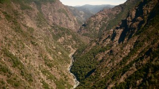 TS01_285 - 1080 stock footage aerial video of following river between mountains in the Sierra Nevada Mountains, California