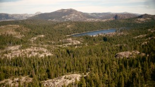 TS01_291 - 1080 stock footage aerial video of approaching Lake Valley Reservoir in the Sierra Nevada Mountains, California