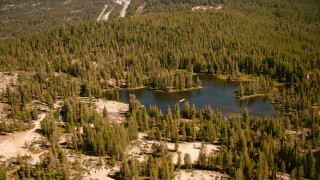 TS01_297 - 1080 stock footage aerial video of Kidd Lake, surrounded by evergreens, in the Sierra Nevada Mountains, California