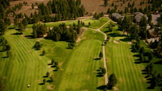 TS01_306 - 1080 stock footage aerial video of flying over Ponderosa Golf Course, revealing highway, Truckee, California