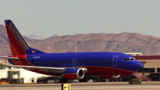 TS02_49 - 1080 stock footage aerial video of Southwest jet at McCarran International Airport, Nevada