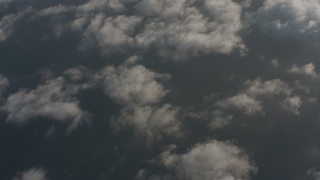 WA001_008 - 4K stock footage aerial video of a bird's eye view of the Pacific Ocean beneath light cloud cover, Southern California