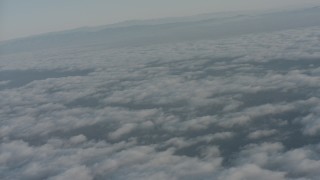 WA001_012 - 4K stock footage aerial video of clouds over Ventura County while approaching mountain ridges, California
