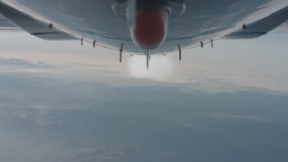 WA001_026 - 4K stock footage aerial video of a view of the contrail from beneath the jet over the Los Padres National Forest, California