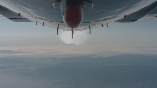 WA001_027 - 4K stock footage aerial video of a reverse view of the bottom of the plane and the contrail over Los Padres National Forest, California
