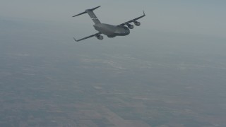 WA001_033 - 4K stock footage aerial video of a Boeing C-17 in flight over Solano County, California