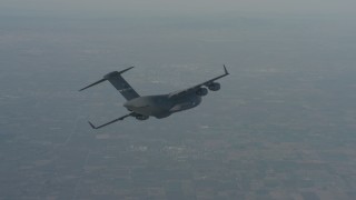 WA001_034 - 4K stock footage aerial video track a Boeing C-17 in flight over Solano County, California