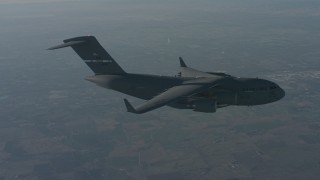 WA001_037 - 4K stock footage aerial video of a Boeing C-17 flying over Solano County, California
