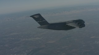 WA001_038 - 4K stock footage aerial video track a Boeing C-17 before it ascends over Solano County, California