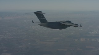 WA001_041 - 4K stock footage aerial video track a Boeing C-17 as it flies ahead over Solano County, California