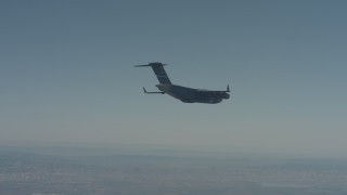 WA001_042 - 4K stock footage aerial video of a Boeing C-17 flying over Solano County, California
