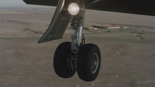 WA001_056 - 4K stock footage aerial video of a view of the Lear jet landing gear as it lands at Travis Air Force Base, California