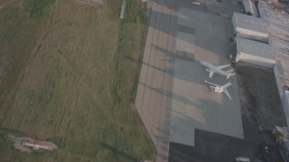 WA002_001 - 4K stock footage aerial video of a view of the runway as a Lear jet takes off from Van Nuys Airport, California