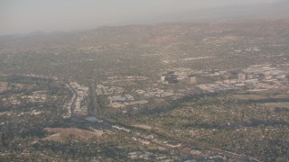 WA002_002 - 4K stock footage aerial video pan across hillside homes and suburban neighborhoods in Woodland Hills, California