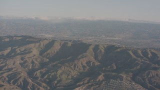 WA002_005 - 4K stock footage aerial video of approaching a ridge in the Santa Susana Mountains, California