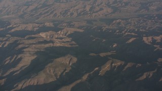 WA002_006 - 4K stock footage aerial video fly over the Santa Susana Mountains to approach farms in Piru, California